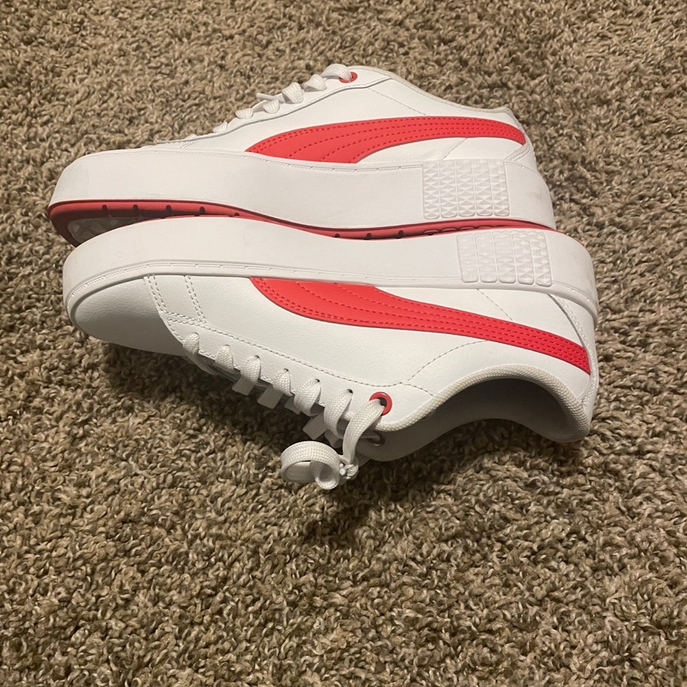 Gently used Red and white Pumas